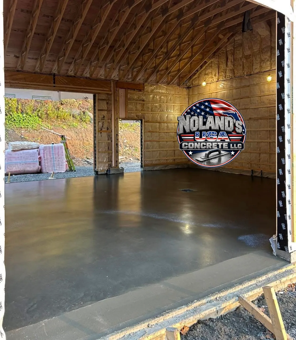 Freshly poured and finished concrete slab inside a new garage